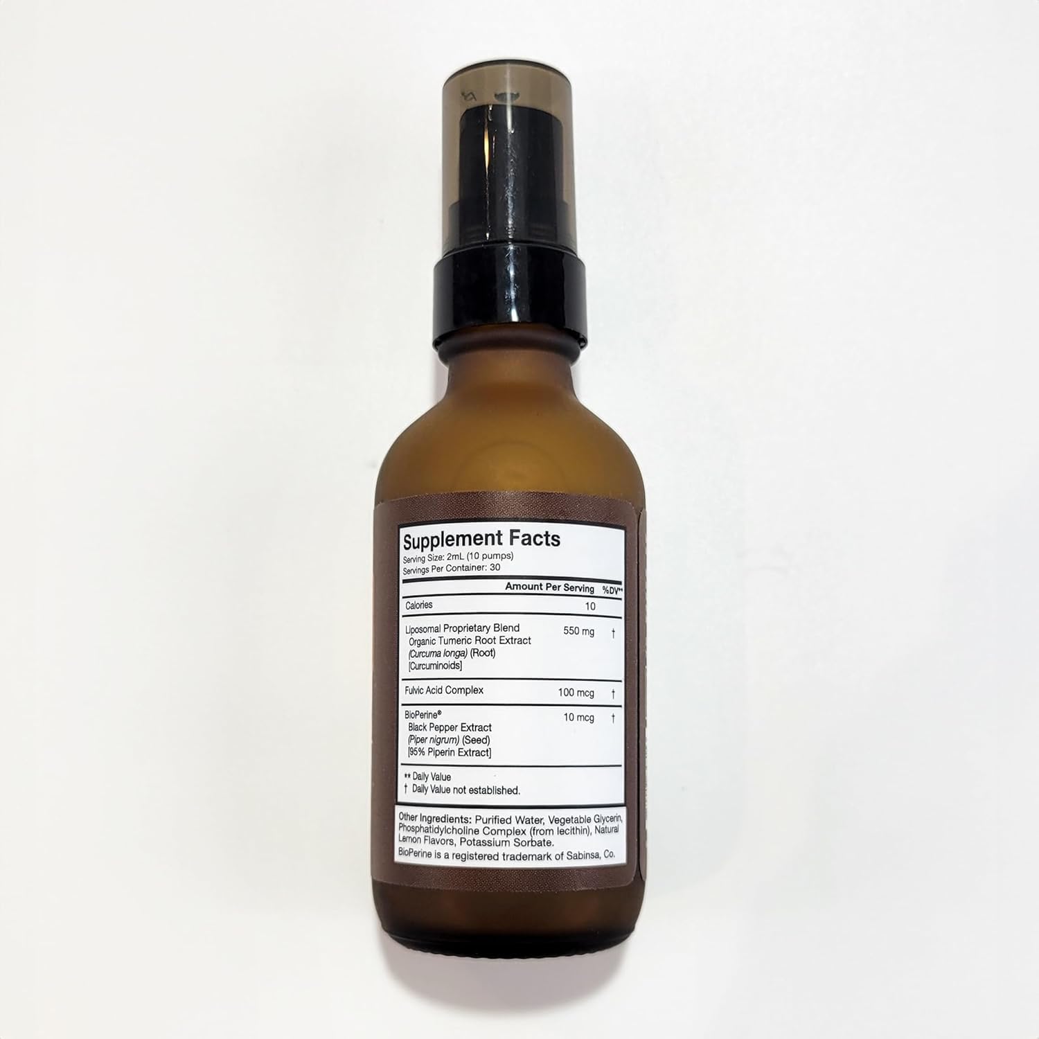 Liquid turmeric supplement bottle with high absorption branding