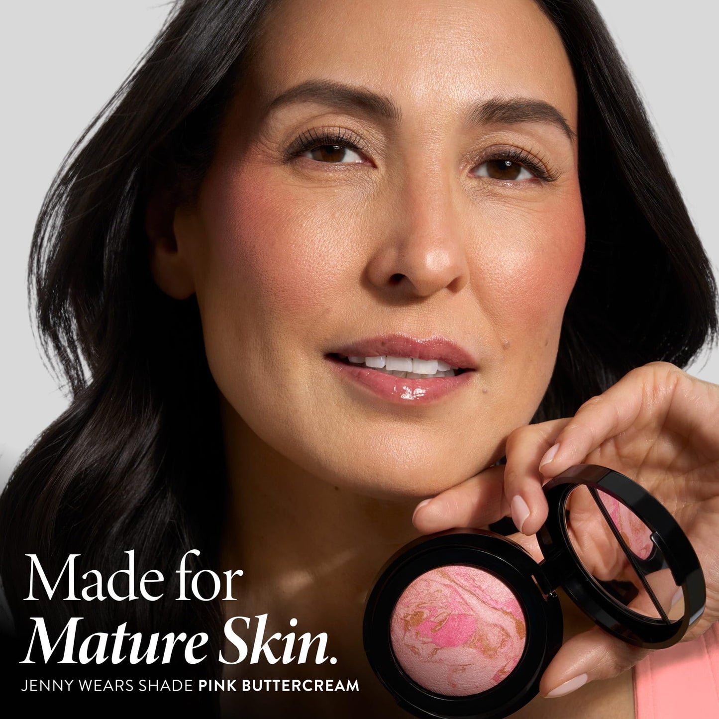 Laura Geller Pink Buttercream baked mineral powder blush showing close-up texture of handmade Italian formula.