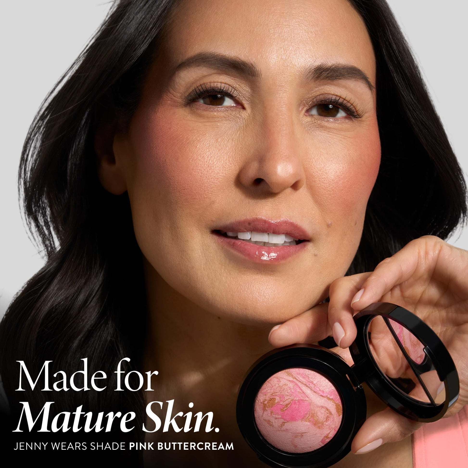 Laura Geller Pink Buttercream baked mineral powder blush showing close-up texture of handmade Italian formula.