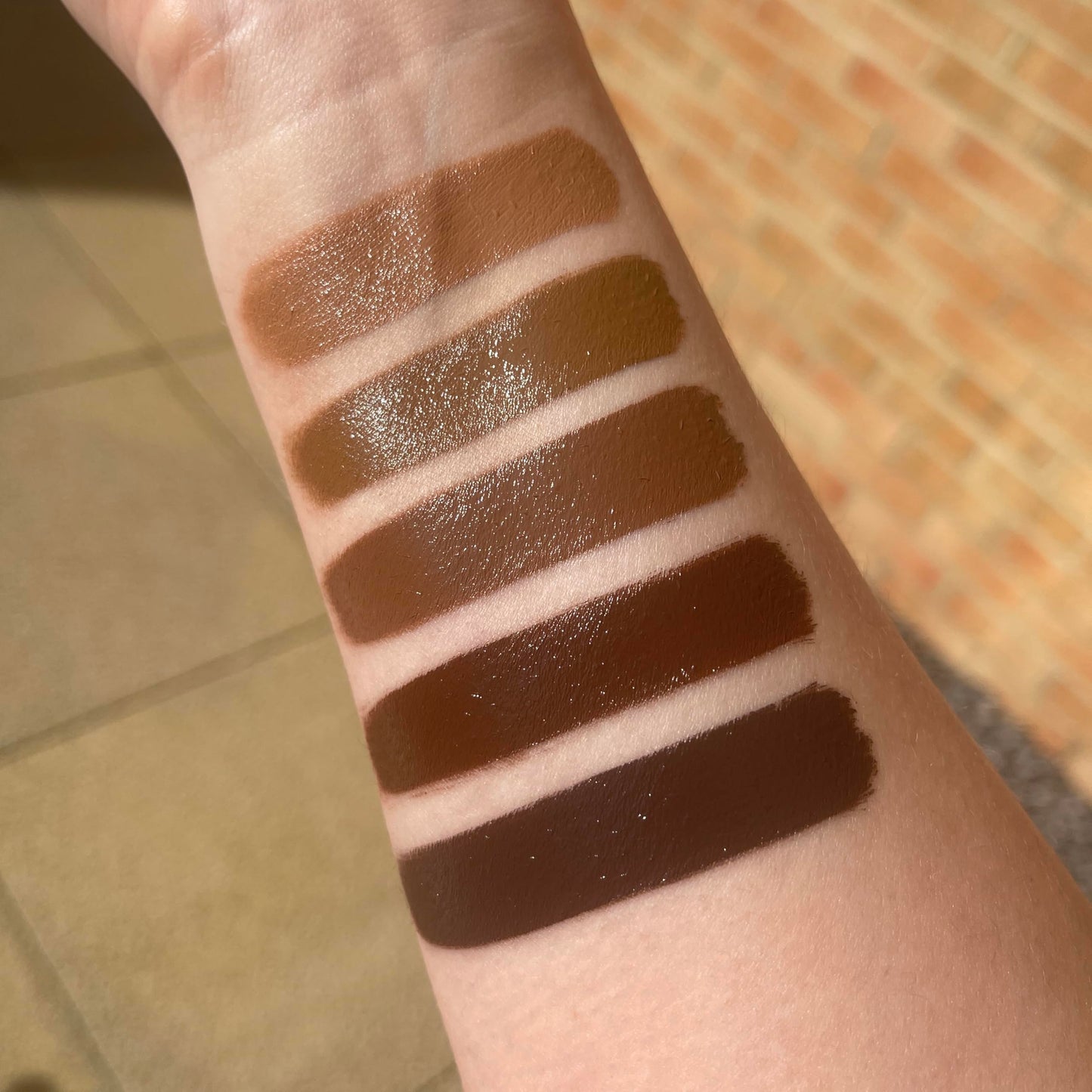 Revolution Beauty face bronzer showing the clear lid compact design