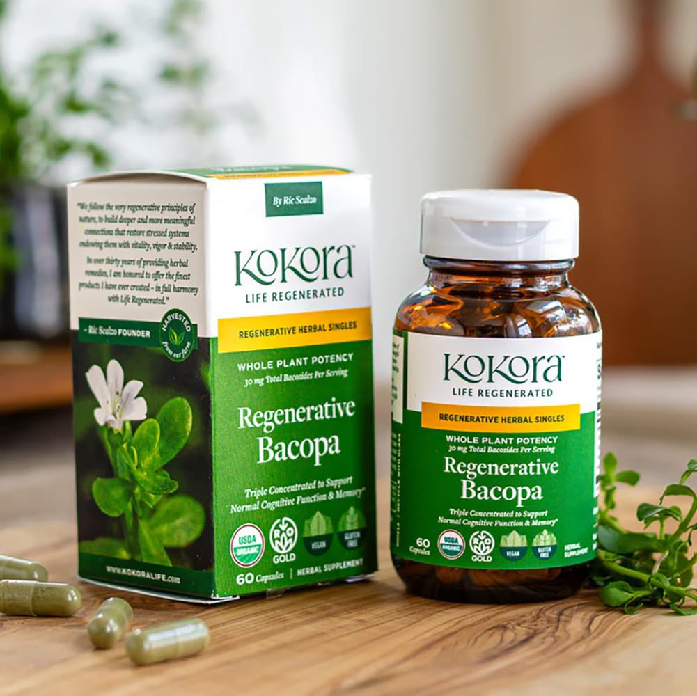 Two vegan capsules of Kokora Bacopa displayed beside the dark glass supplement bottle.