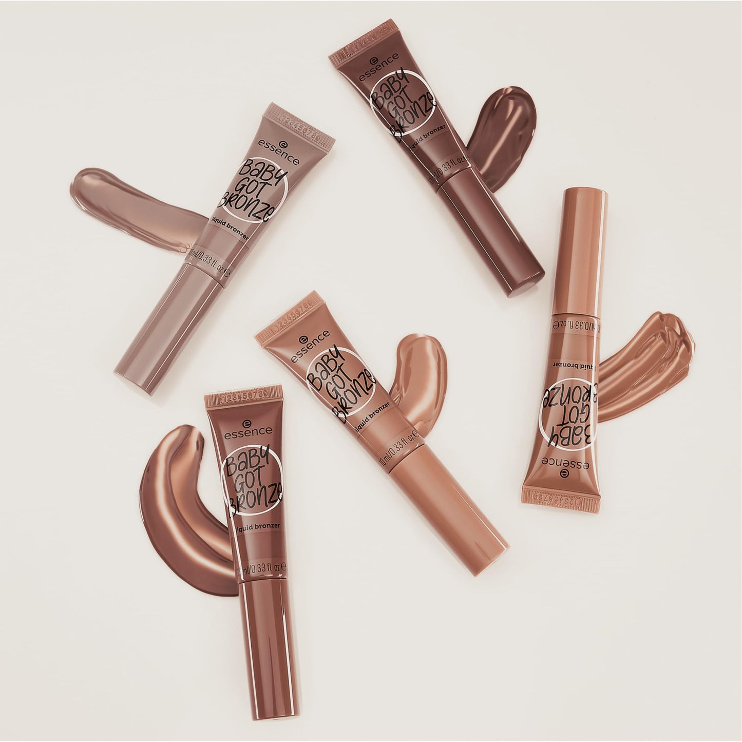Side profile view of the 10 Milliliters Essence Baby Got Bronze tube highlighting the vegan logo.