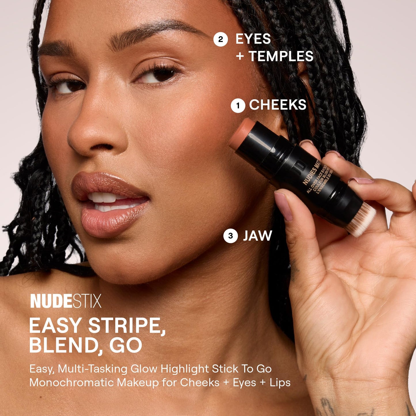 Creamy texture swatch of Nudestix Sunkissed bronzer stick highlighting the warm rosy brown matte color payoff.