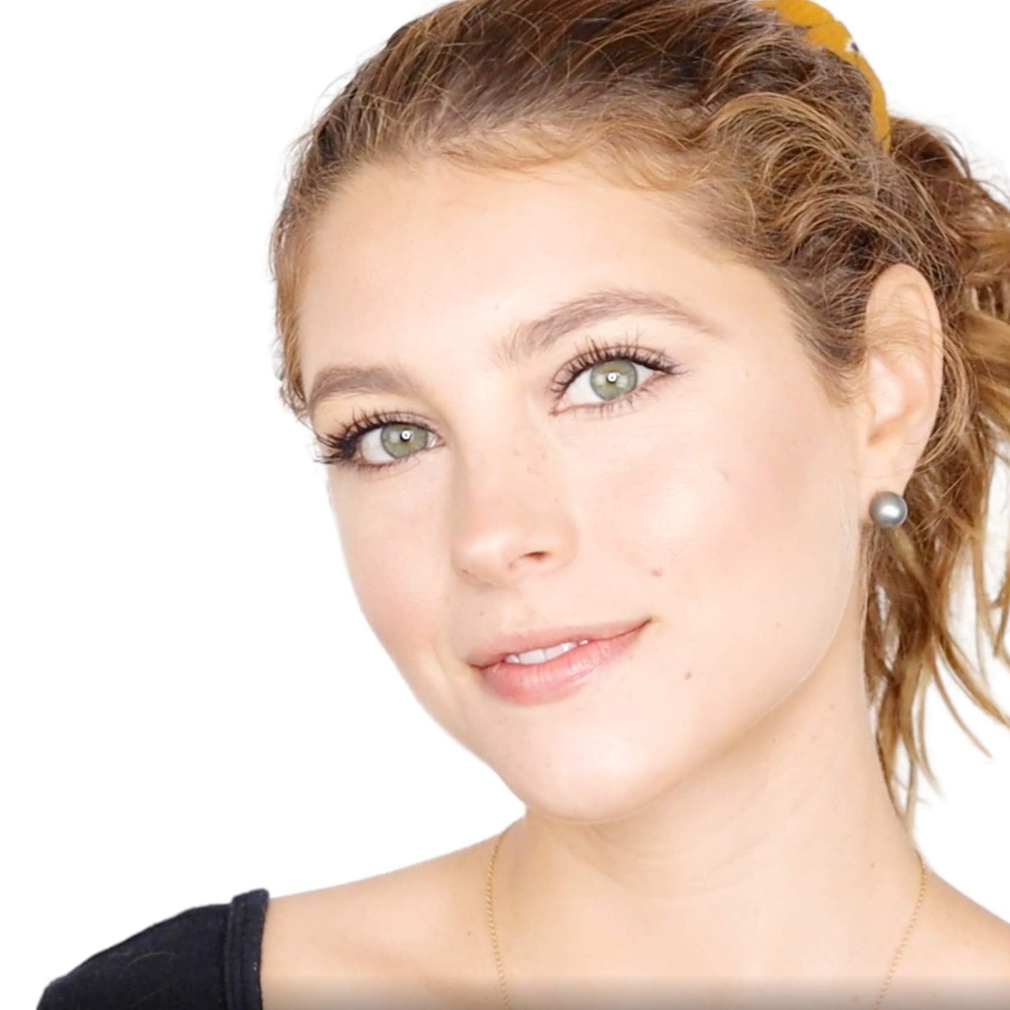 Elizabeth Mott universal shade face bronzer showing the pressed powder texture under natural lighting.