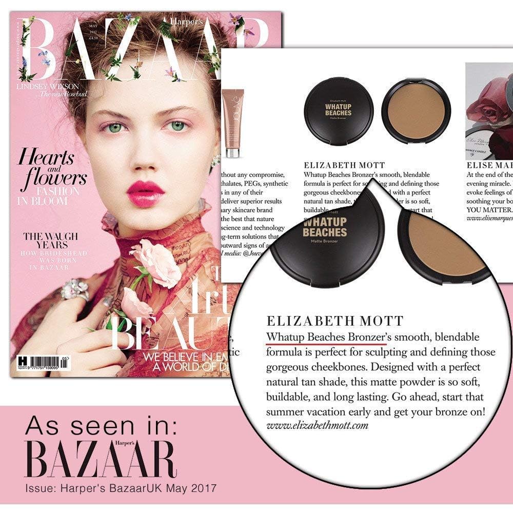 Elizabeth Mott buildable pressed powder compact opened next to a professional contouring makeup brush.