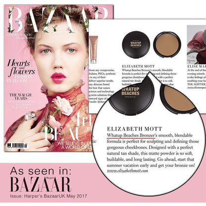 Elizabeth Mott buildable pressed powder compact opened next to a professional contouring makeup brush.