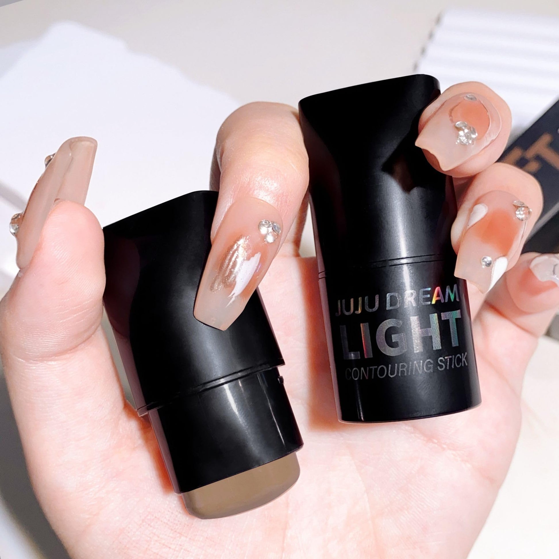 Matte cool-toned cream contour stick showing the Cold Gray Brown makeup product extended.