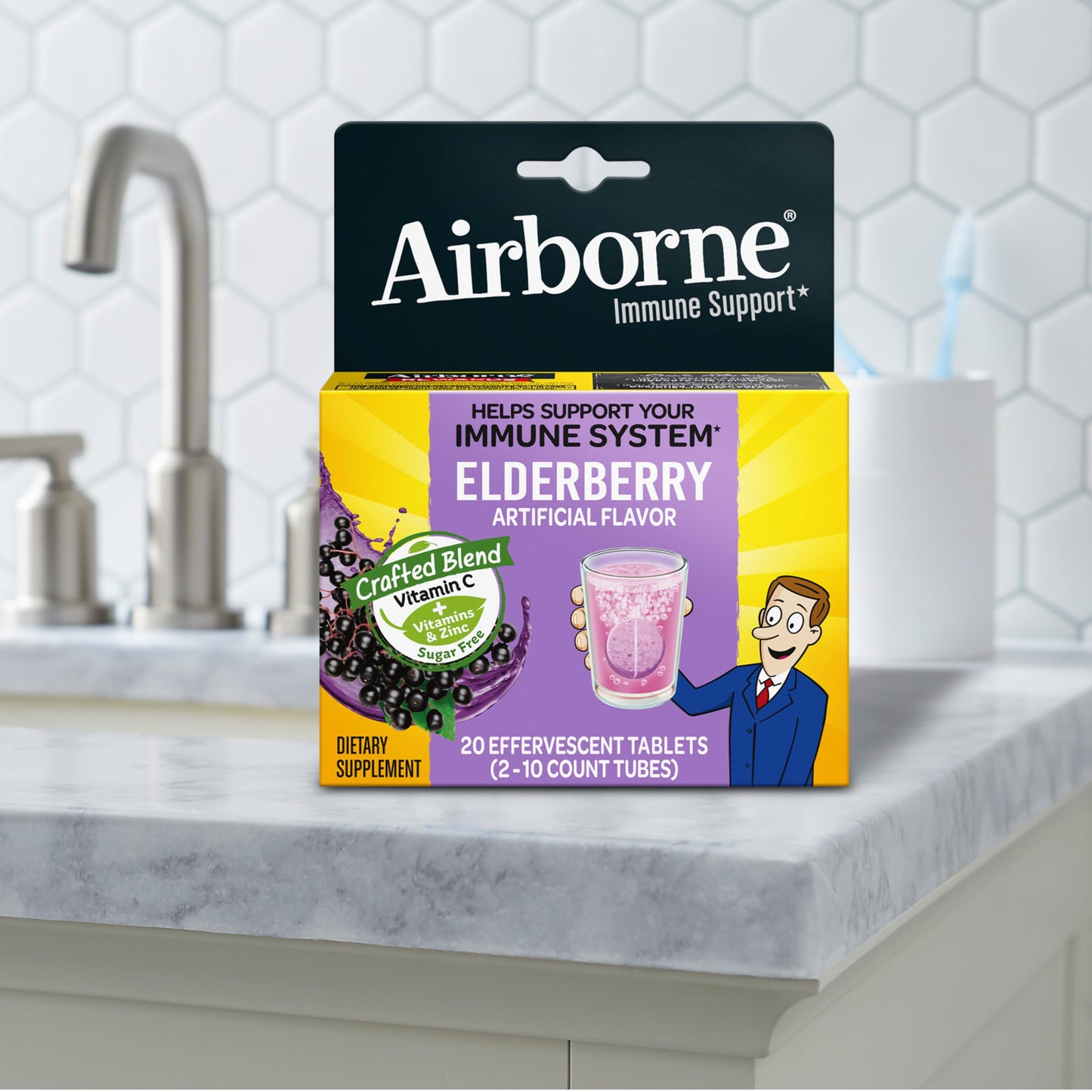 Airborne authentic USA imported wellness tablets being dropped into a clean glass of clear drinking water