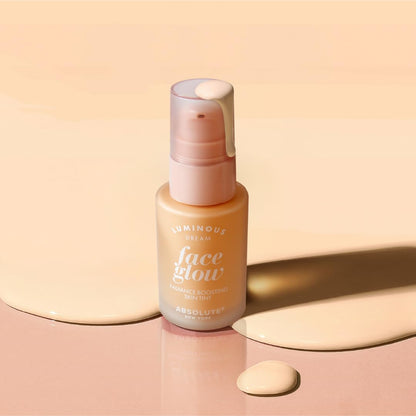 Absolute New York oil free radiant skin tint container resting on a clean vanity setup.