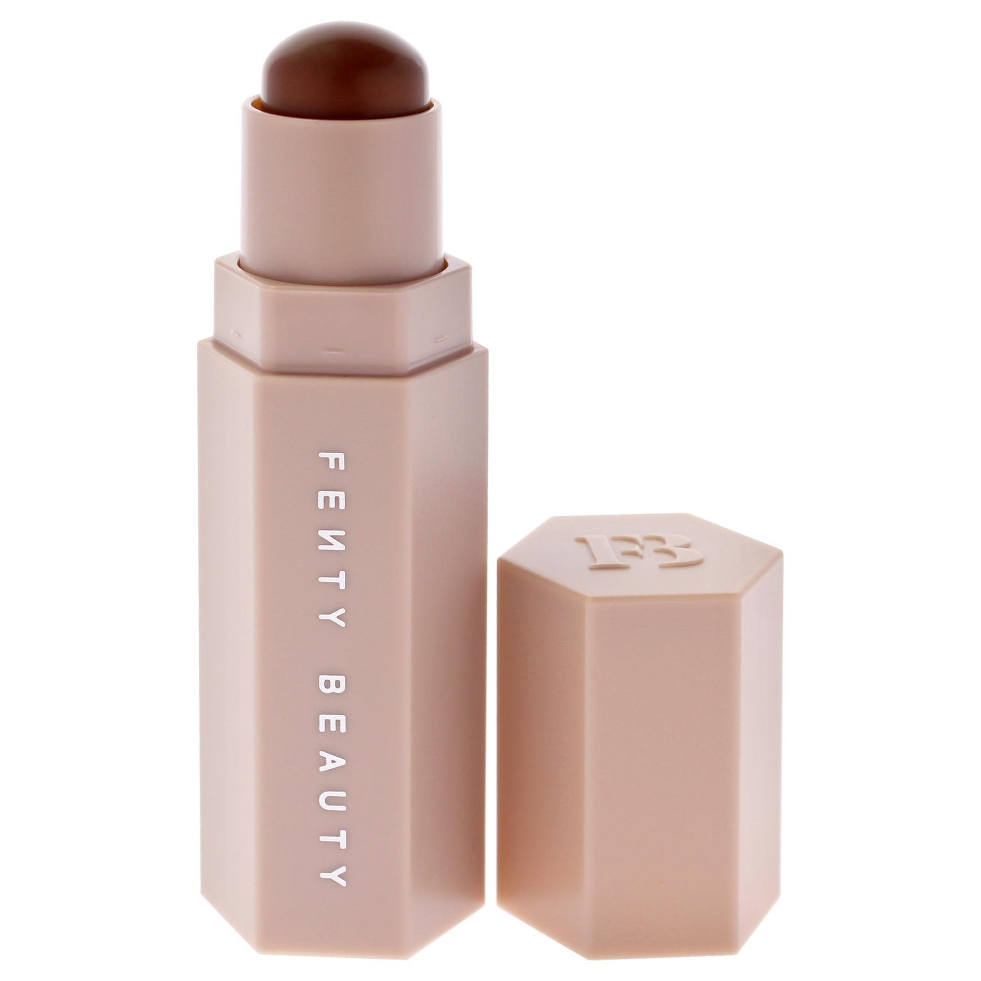 Fenty Beauty cream to powder contour stick in Truffle swatched onto a clean surface to display the rich cool brown color.
