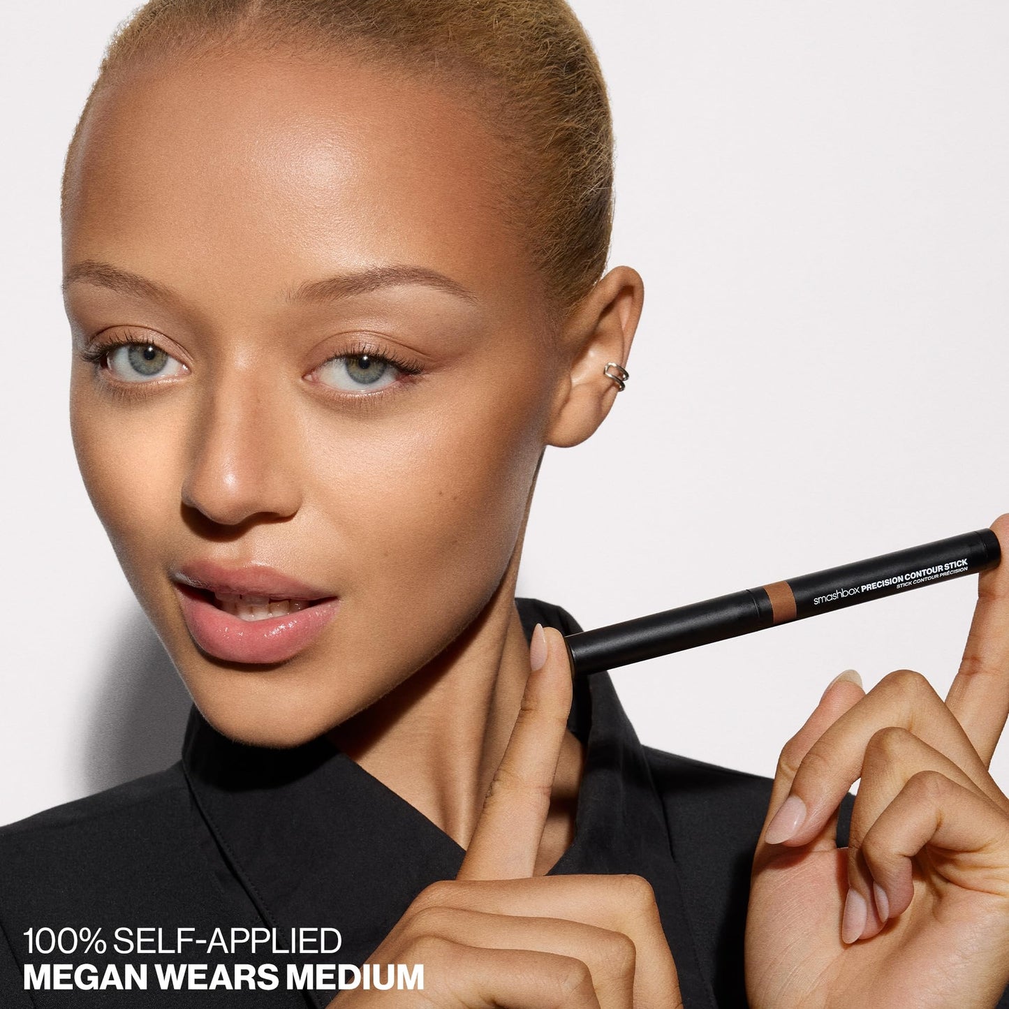 Creamy blendable face sculpting stick swatch on medium skin tone