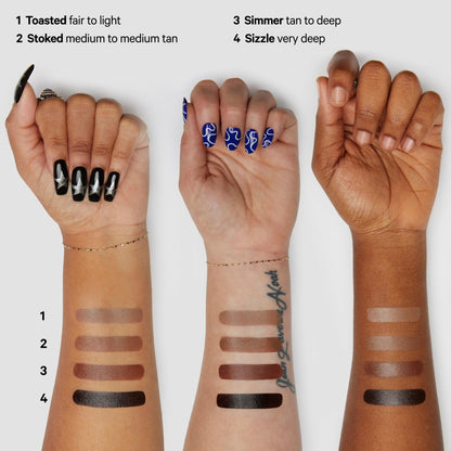 Milk Makeup pocket sized cream contour stick held to showcase compact size