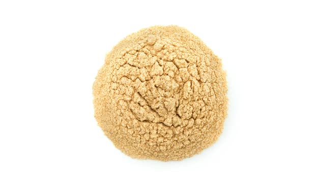 Texture close-up of Yupik coarse-milled psyllium husk powder