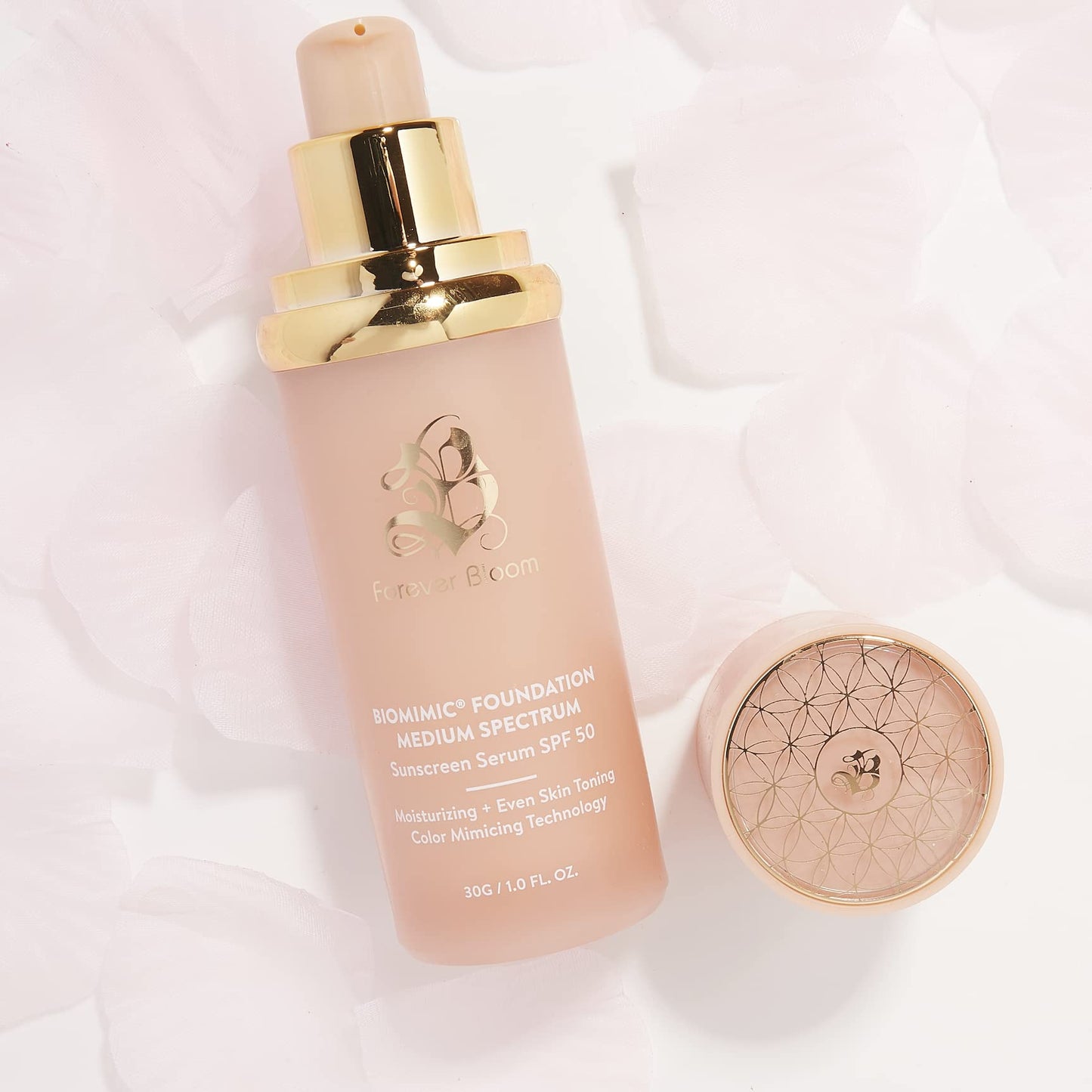 Moisturizing sun defense foundation serum bottle on clean background