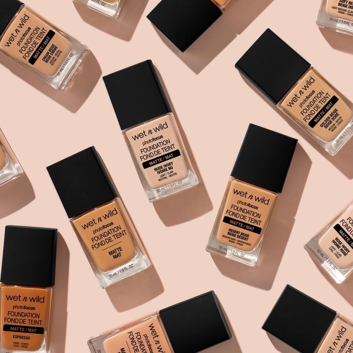 Side view of the one fluid ounce glass foundation bottle showcasing the true Soft Beige shade color