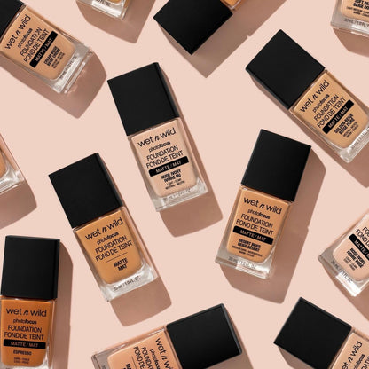 Side view of the one fluid ounce glass foundation bottle showcasing the true Soft Beige shade color