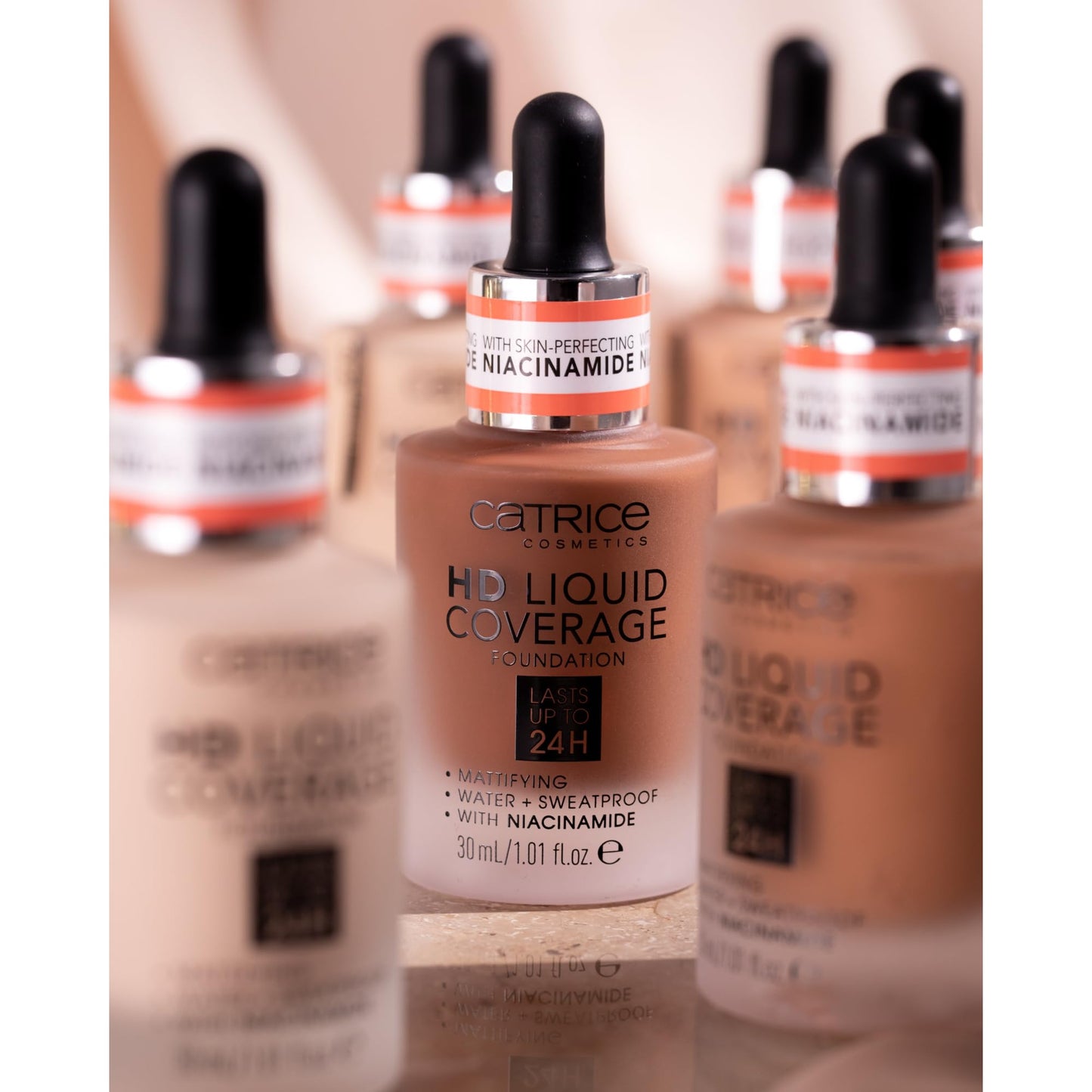 Catrice liquid foundation bottle standing upright highlighting its waterproof and sweatproof properties