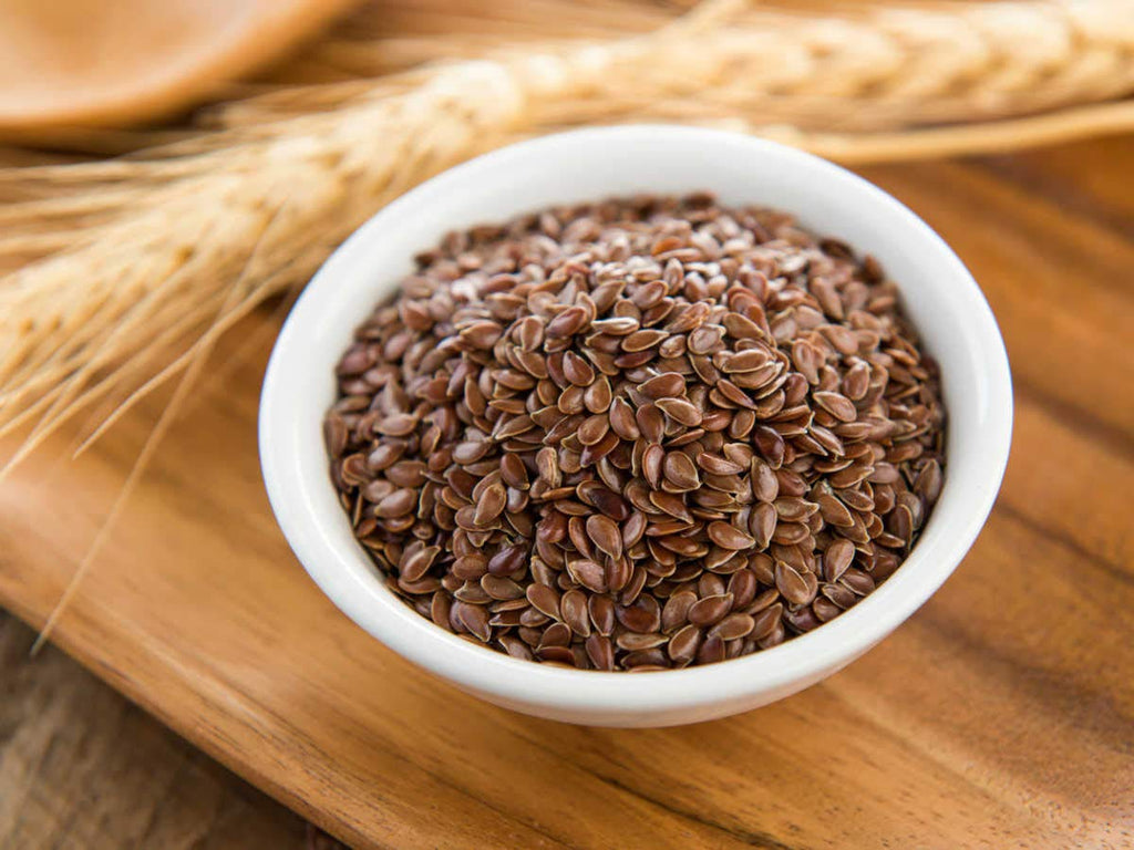 Close up view of premium whole unroasted brown flax seeds for natural weight loss and healthy digestion