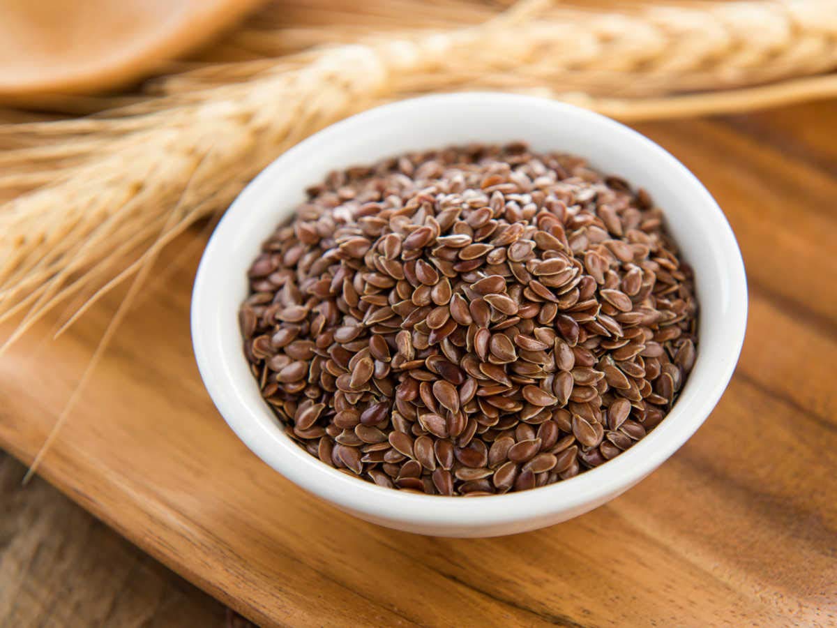 Close up view of premium whole unroasted brown flax seeds for natural weight loss and healthy digestion