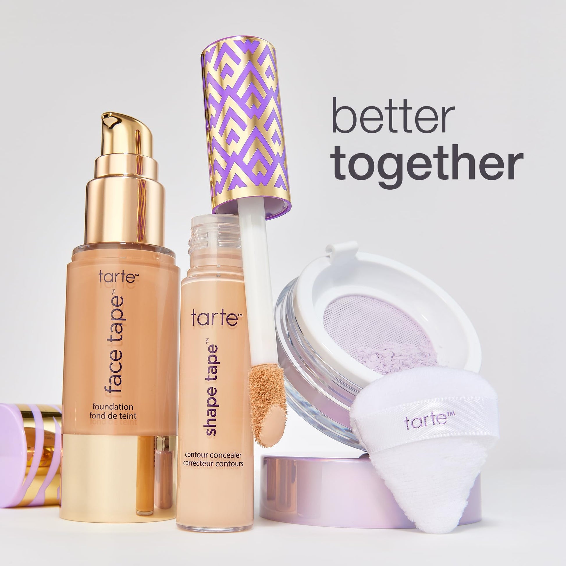 Tarte full coverage liquid foundation bottle standing next to brush