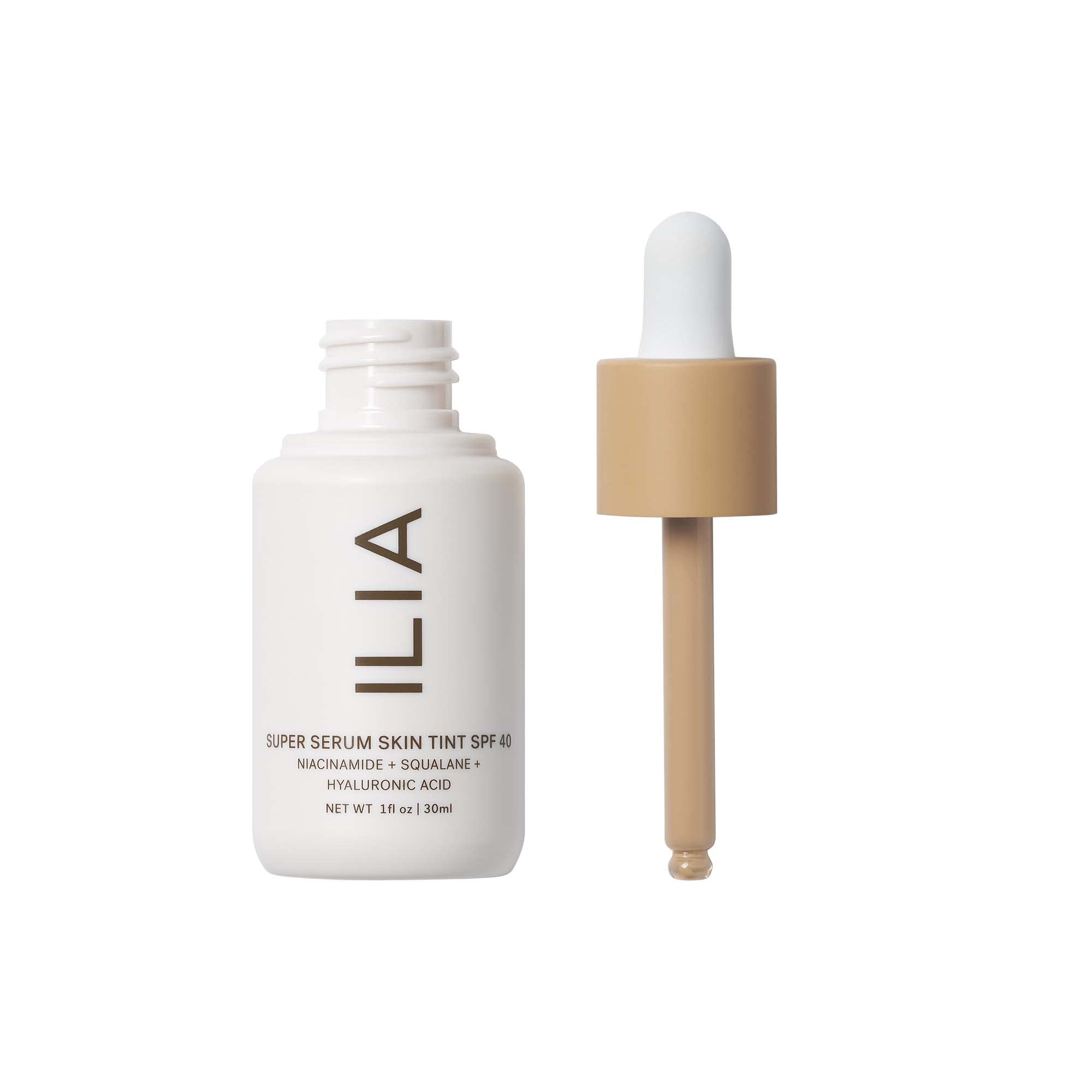 ILIA tinted sunscreen foundation liquid serum dropping from glass pipette dispenser