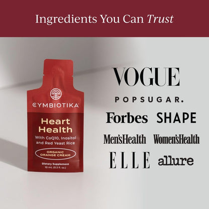 Cymbiotika Heart Health 30 serving box next to a water glass showing how to mix the liposomal formula.