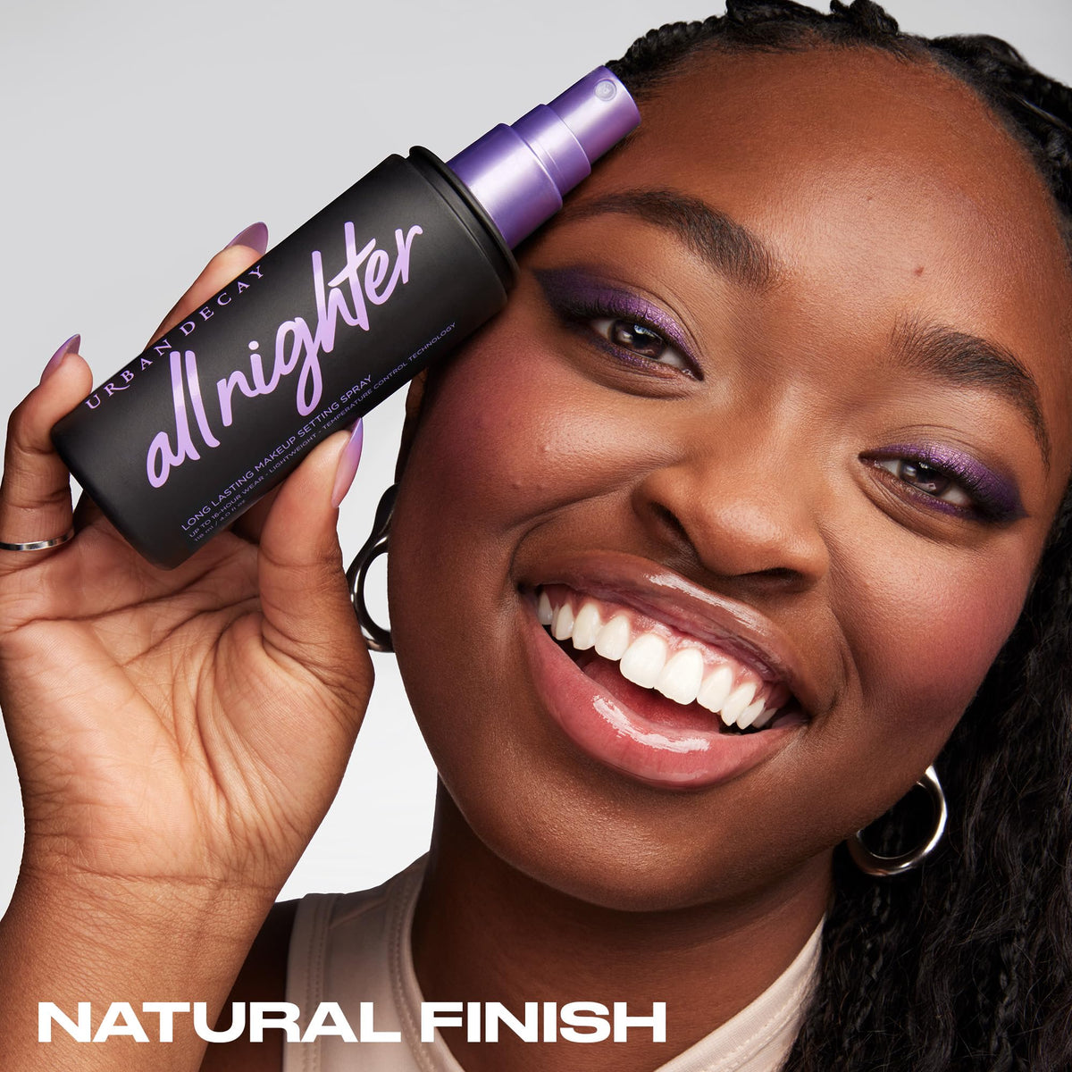 Urban Decay All Nighter makeup setting spray held in hand