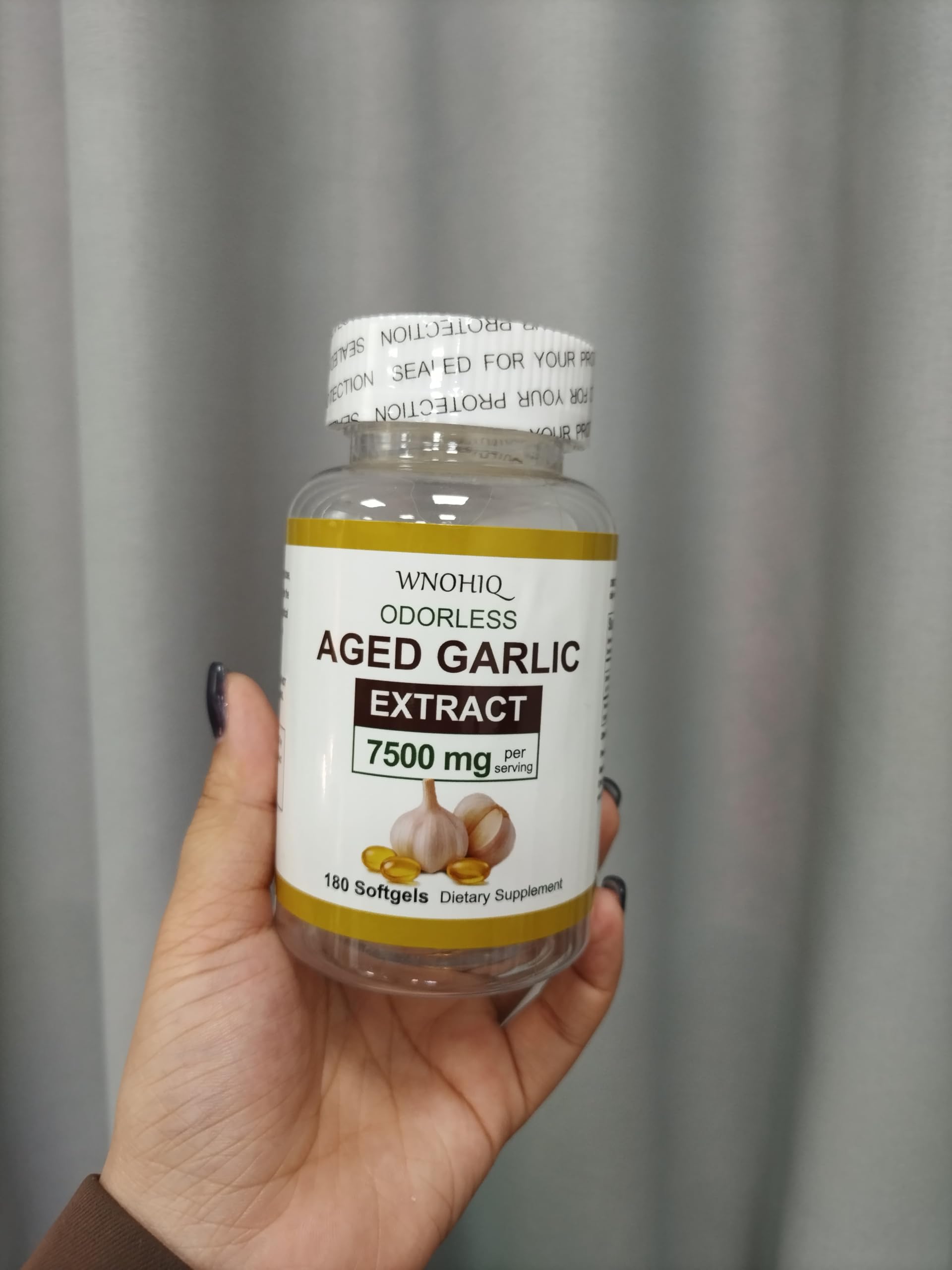 RTQSU odorless garlic supplement softgels next to the imported USA bottle.