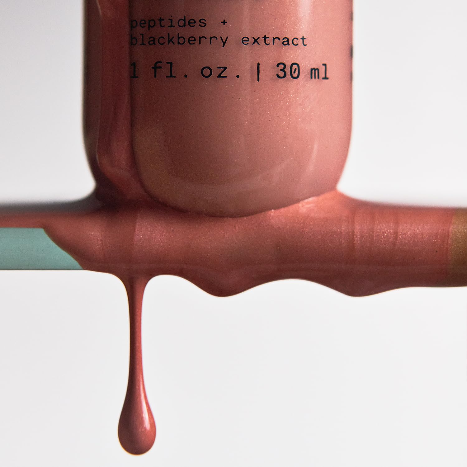Versed liquid highlight and bronzing drops bottle showing product consistency.