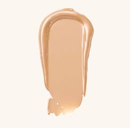 Catrice dewy glow booster makeup fluid packaging showcasing product benefits and ingredients list.