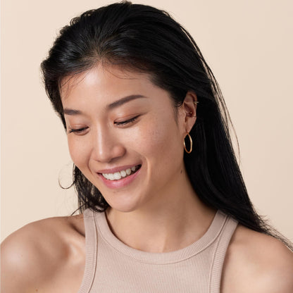 Catrice vegan skincare infused makeup base bottle highlighting the Vitamin E and Squalane formula.