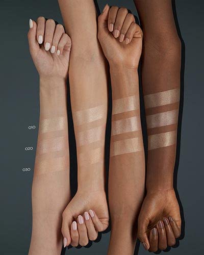 Catrice pressed powder highlighter styled alongside makeup application brush
