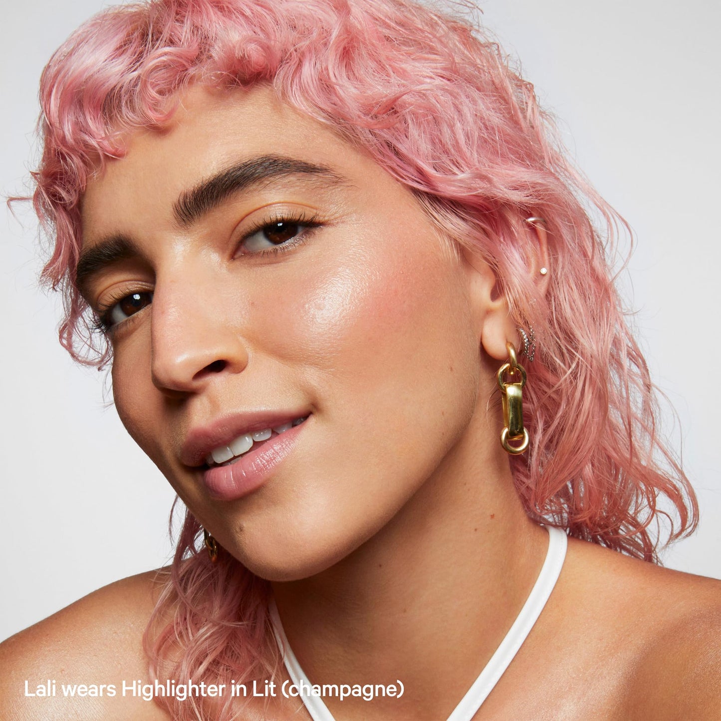 Milk Makeup clean vegan cream highlighter stick Lit shade application angle