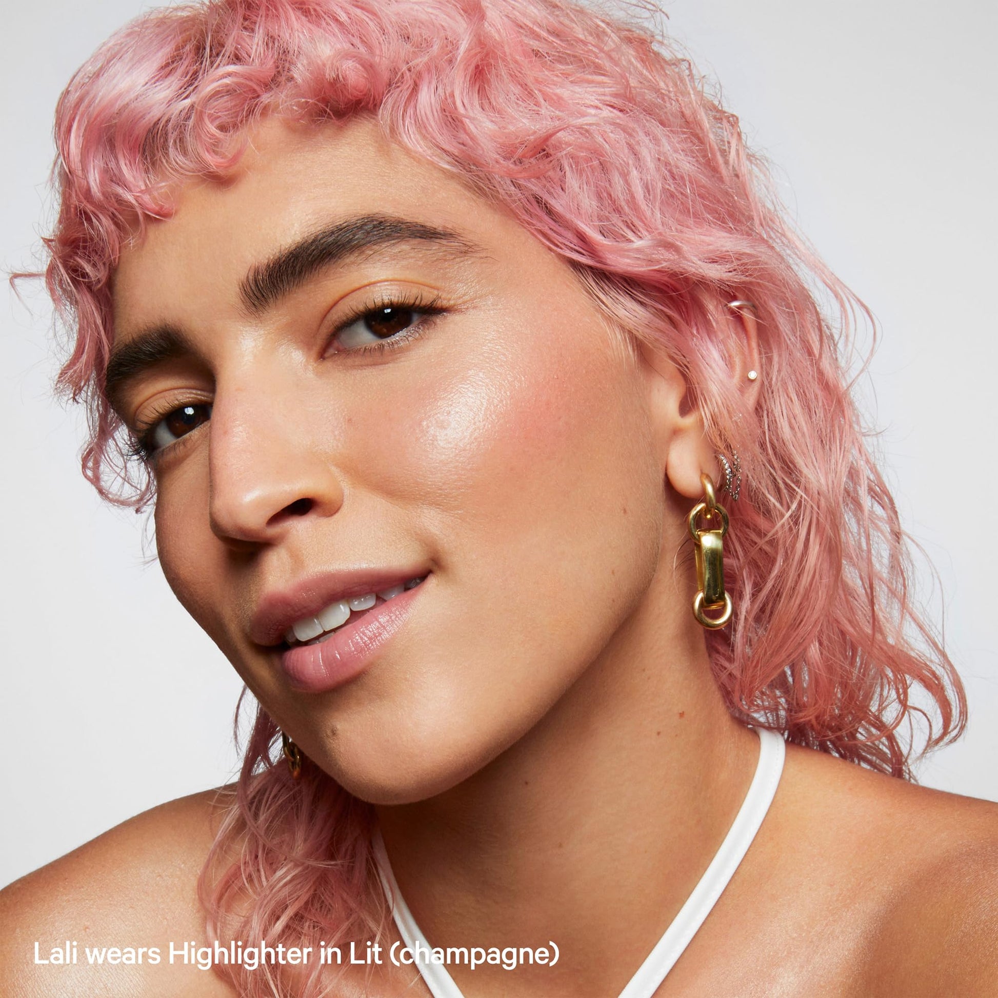 Milk Makeup clean vegan cream highlighter stick Lit shade application angle