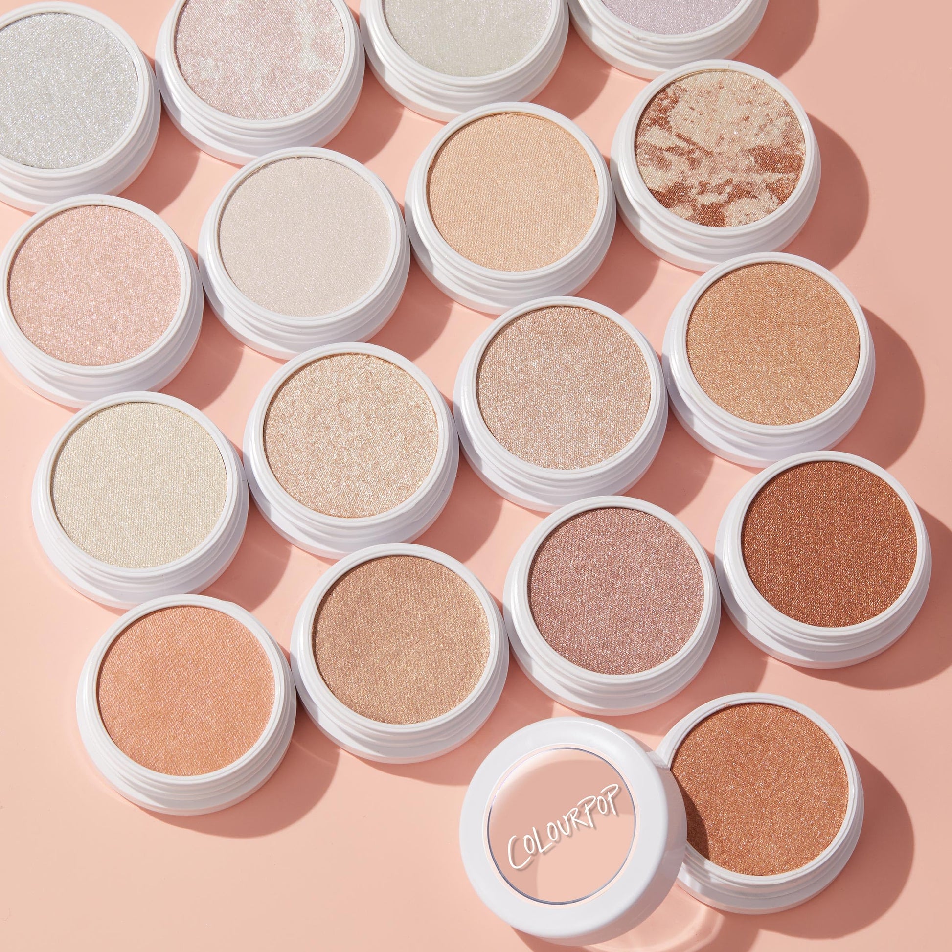 Side angle of closed white screw top pot for weightless cream face makeup.