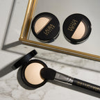 Laura Geller face highlighter applied on cheekbones