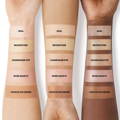 Applying the radiant glow-boosting Smashbox highlighter on cheekbones with a cosmetic brush