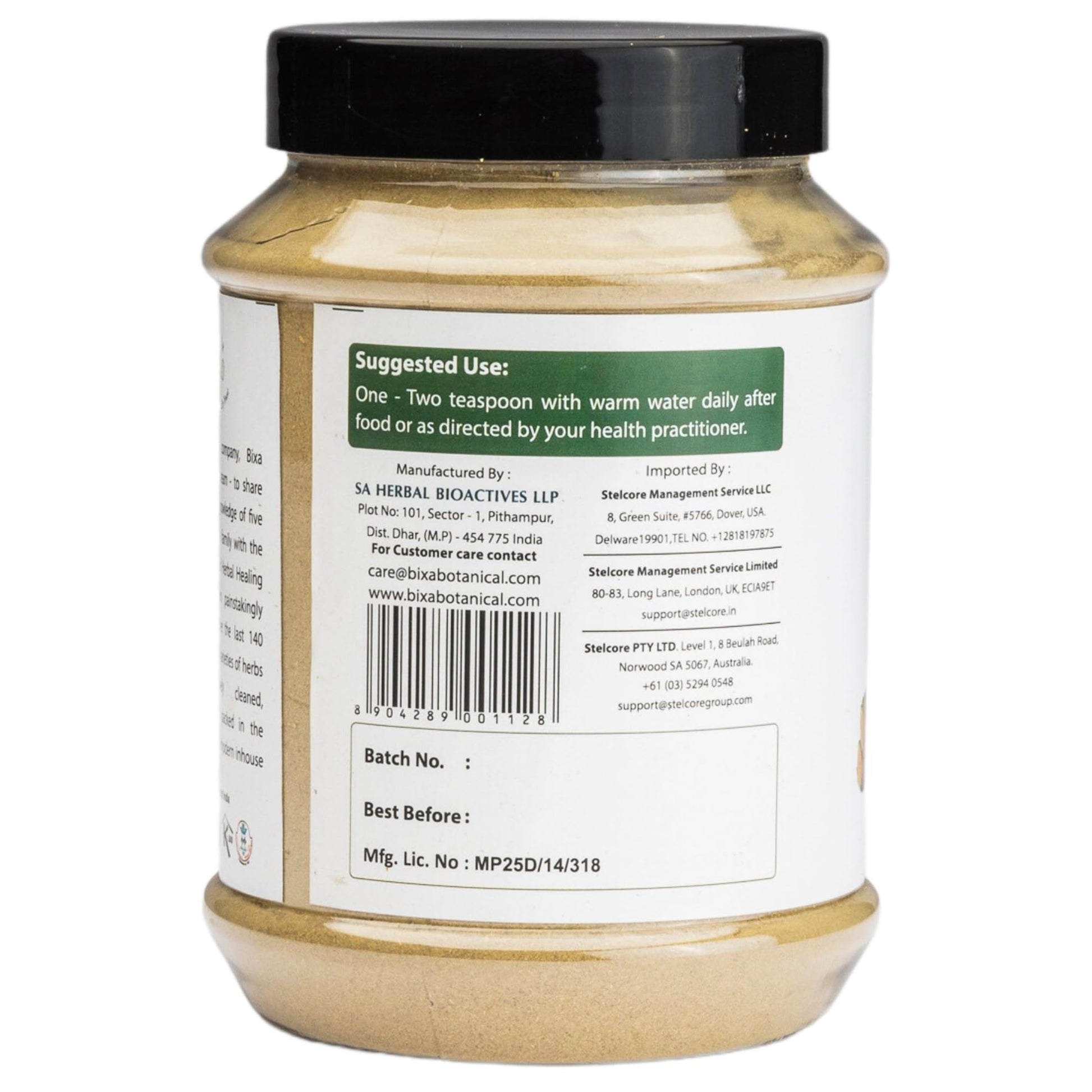 A teaspoon of Bixa Botanical Guduchi powder next to warm water glass