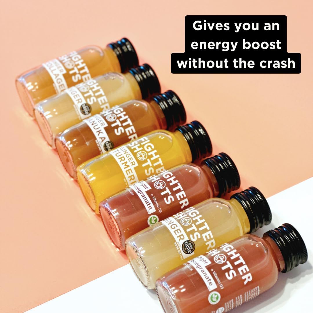 Fighter Shots premium ginger wellness shot held in hand highlighting its compact travel size.