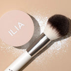 Ilia fade into you powder open jar showing sifter