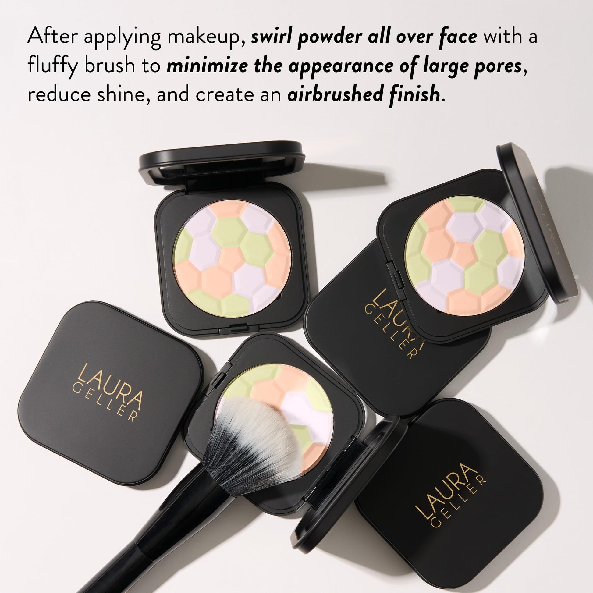 Laura Geller pressed powder compact held in hand