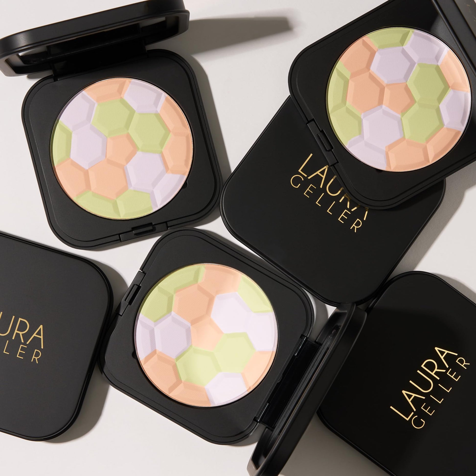 Application of Laura Geller setting powder with professional brush
