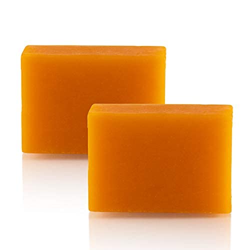 Close up of the 65 grams Kojie San beauty bars revealing texture and rich orange color for uneven skin tone