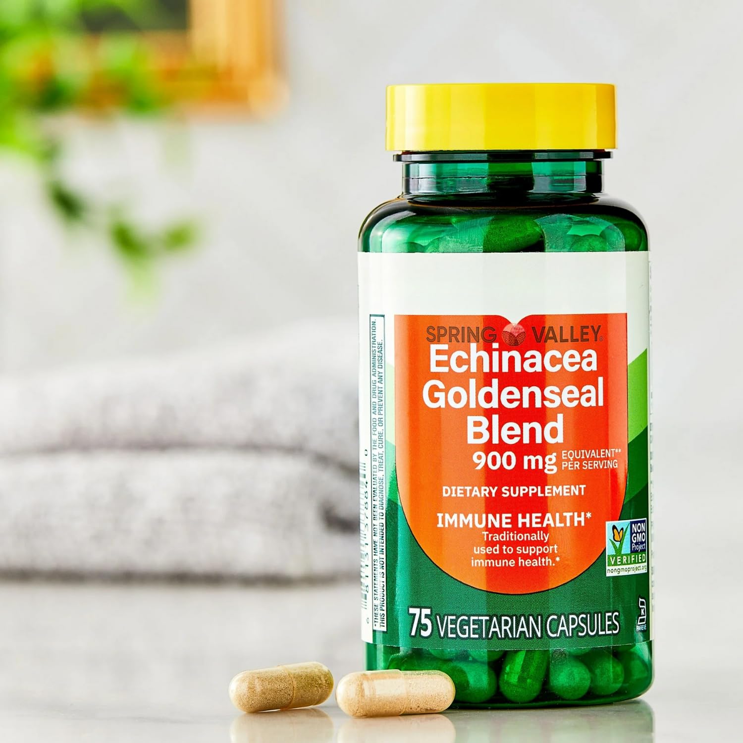 Three bottles of Spring Valley Echinacea Goldenseal 75 vegetarian capsules standing side by side