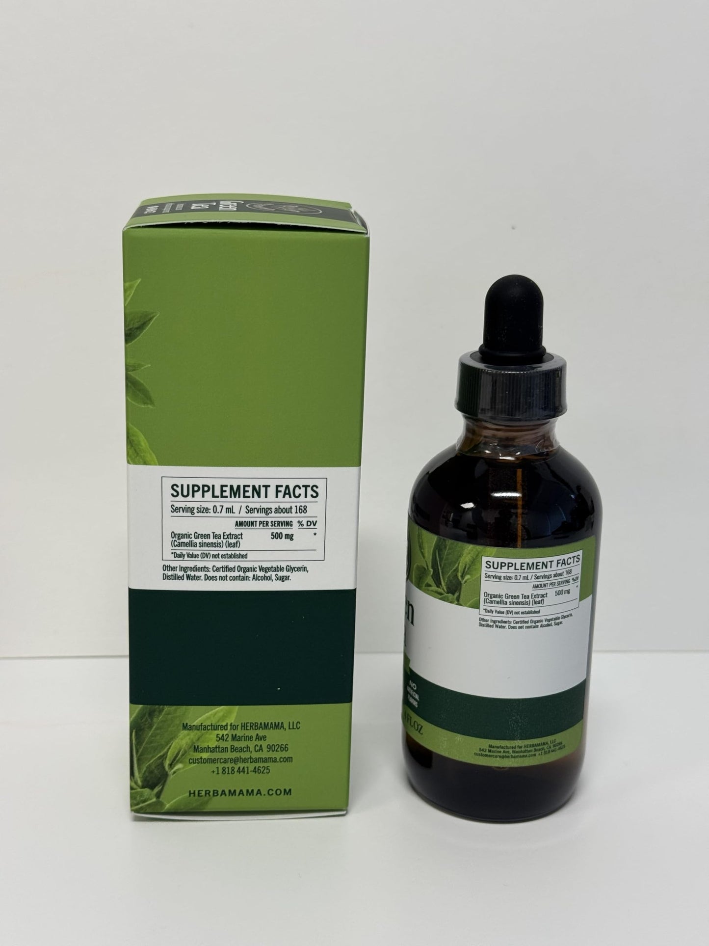 Close up of Herbamama green tea extract amber glass packaging