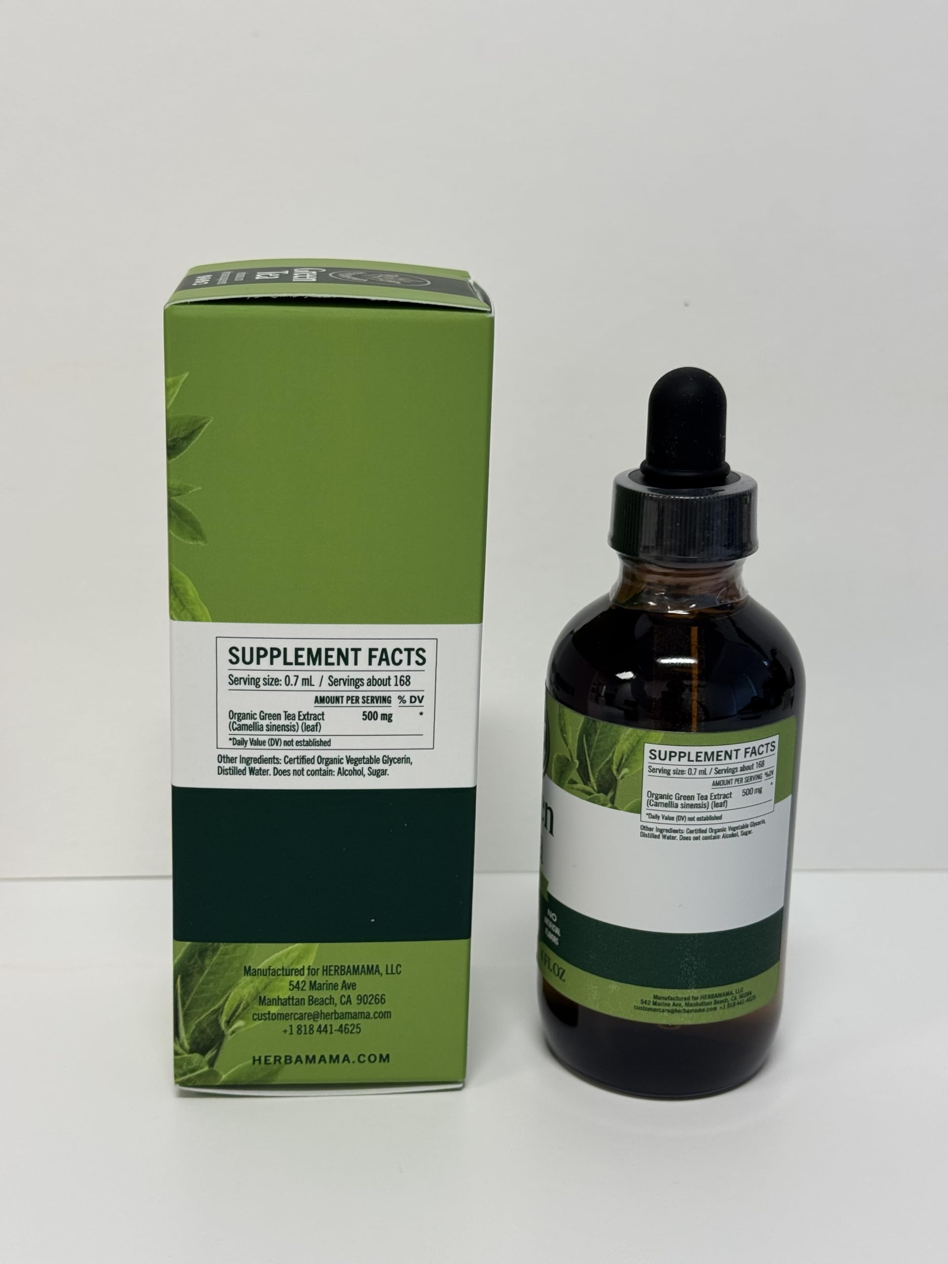 Close up of Herbamama green tea extract amber glass packaging