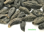 Sanaa Zesty whole Haritaki seeds displaying raw texture and quality.