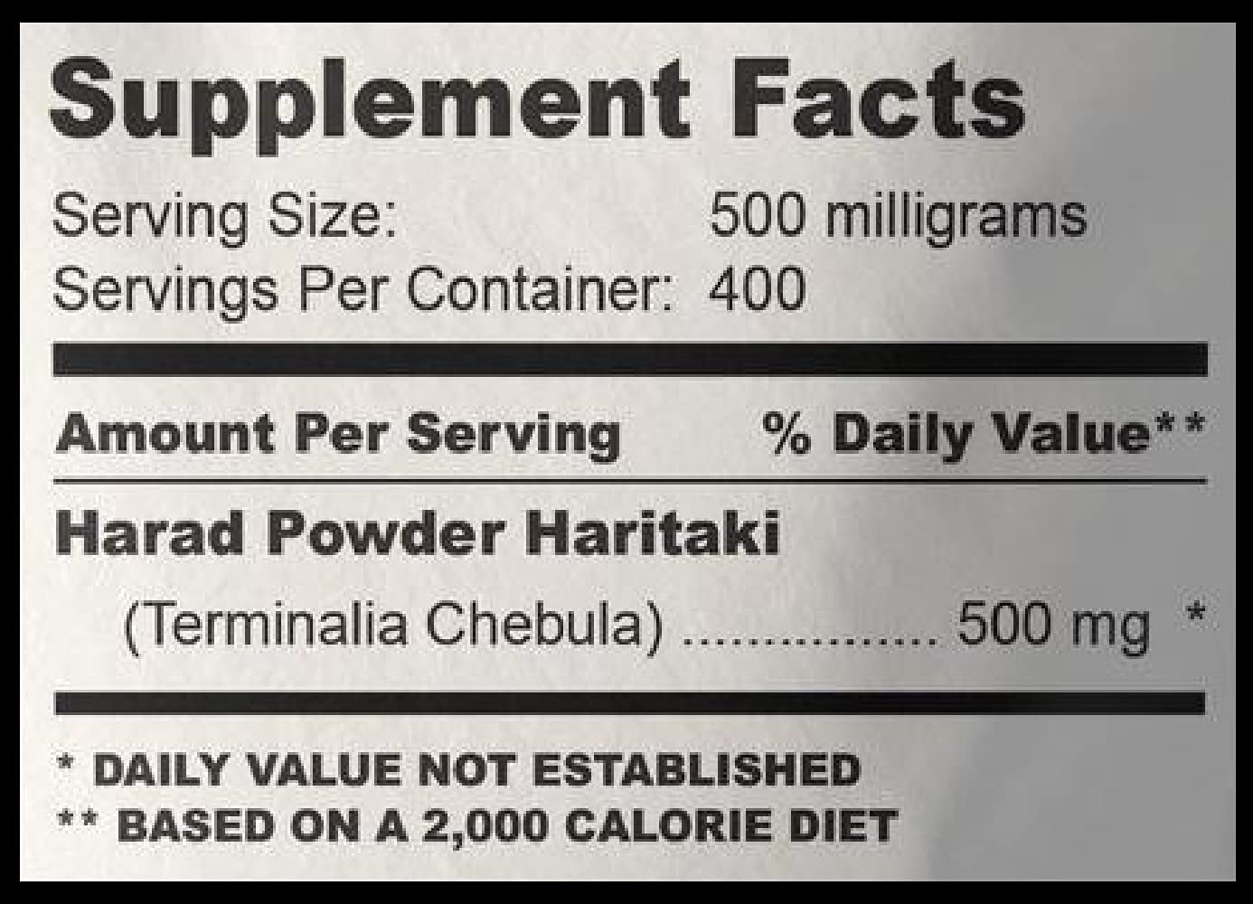 Authentic USA imported Haritaki powder bag showing Ayurvedic benefits list.