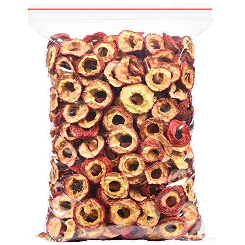 Hollow circle dried hawthorn berries close up showing bright red peels