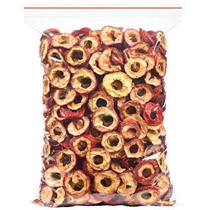 Hollow circle dried hawthorn berries close up showing bright red peels
